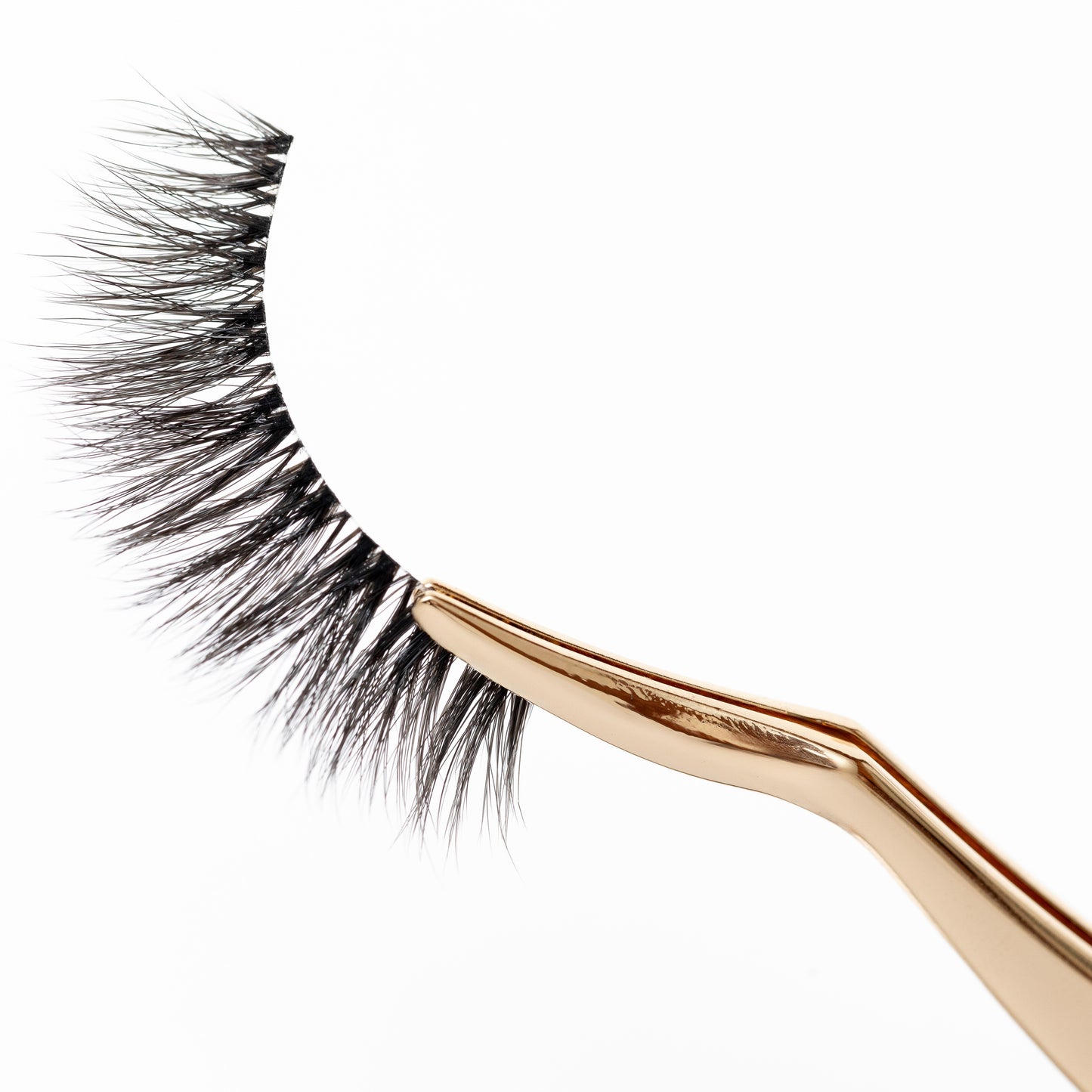 Gold metal lash applicator designed for flawless application of lash extensions and strip lashes, showcasing elegant design.