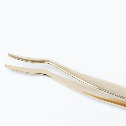 Gold metal lash applicator designed for precise application of lash extensions and strip lashes.
